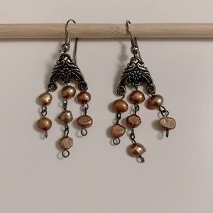 Drop earrings with gold/rose gold beads.